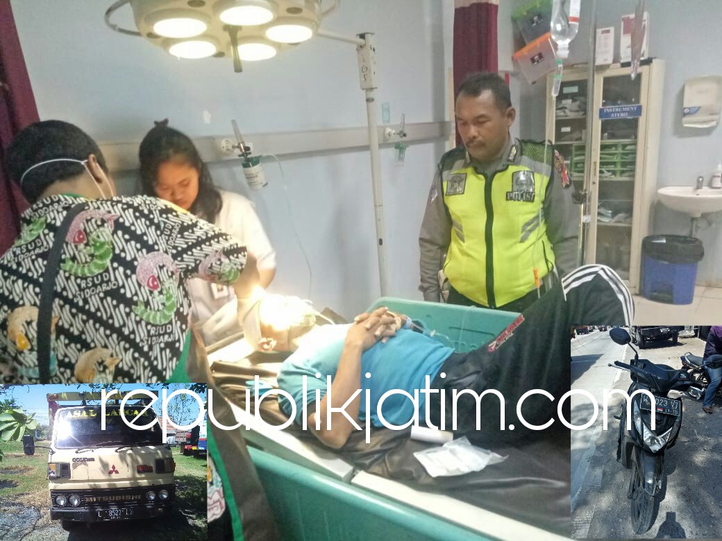 DIRAWAT - Petugas Lantas Polsek Porong mendampingi korban, M Munib korban kecelakaan saat mendapatkan perawatan medis RSUD Sidoarjo, Rabu (23/05/2018).
