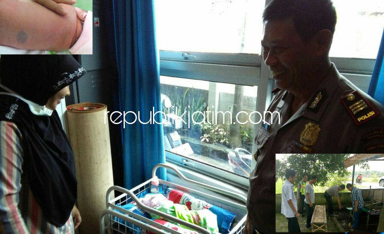 BAYI PEREMPUAN - Kapolsek Prambon, AKP Isharyata melihat kondisi bayi perempuan yang dibuang di warung Desa Wonoplintahan, Kecamatan Prambon, Kabupaten Sidoarjo saat dirawat di Puskesmas Prambon, Minggu (07/01/2018).