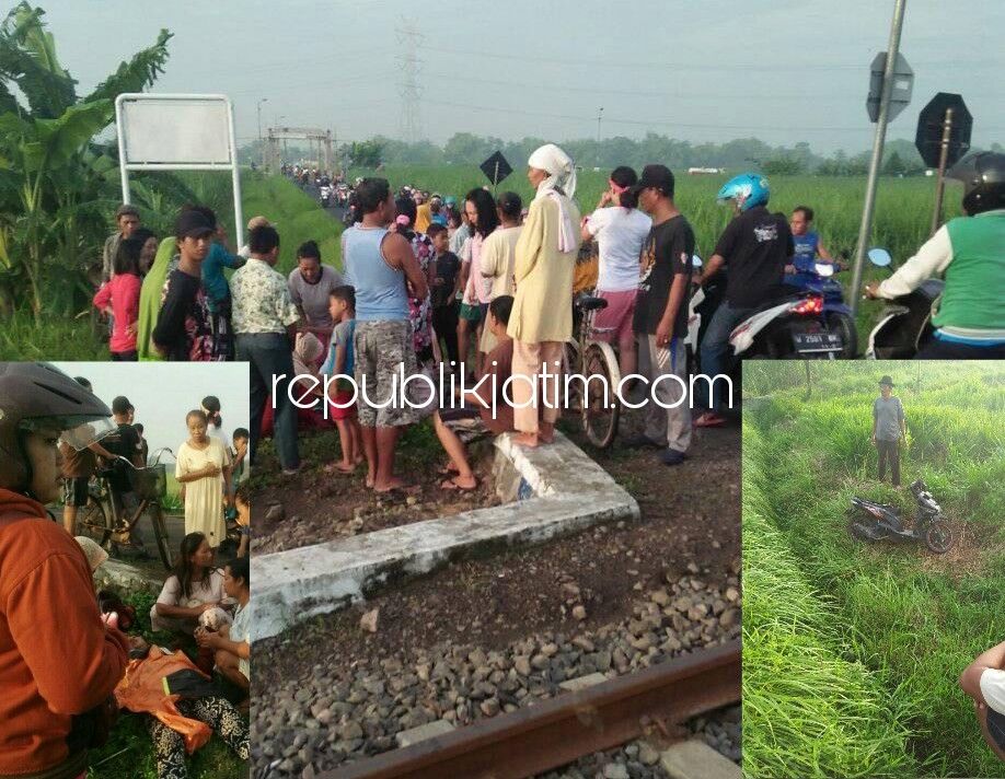 PINGSAN - Kondisi korban, Ratnatul Insiyah tergeletak pingsan di tepi rel perlintasan KA Dusun Malangbong, Desa Kepunten, Kecamatan Tulangan bersama motornya menjadi tontonan warga seusai disambar KA Jenggala, Rabu (21/02/2018).